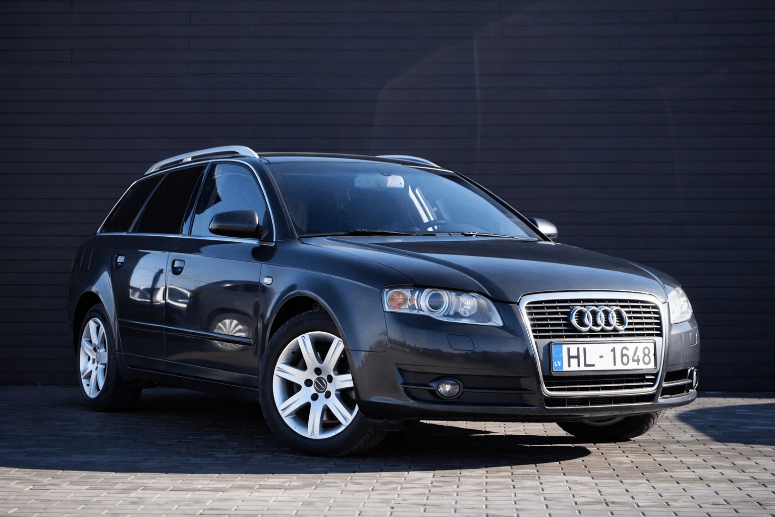 Audi A4 Avant on grey pavement