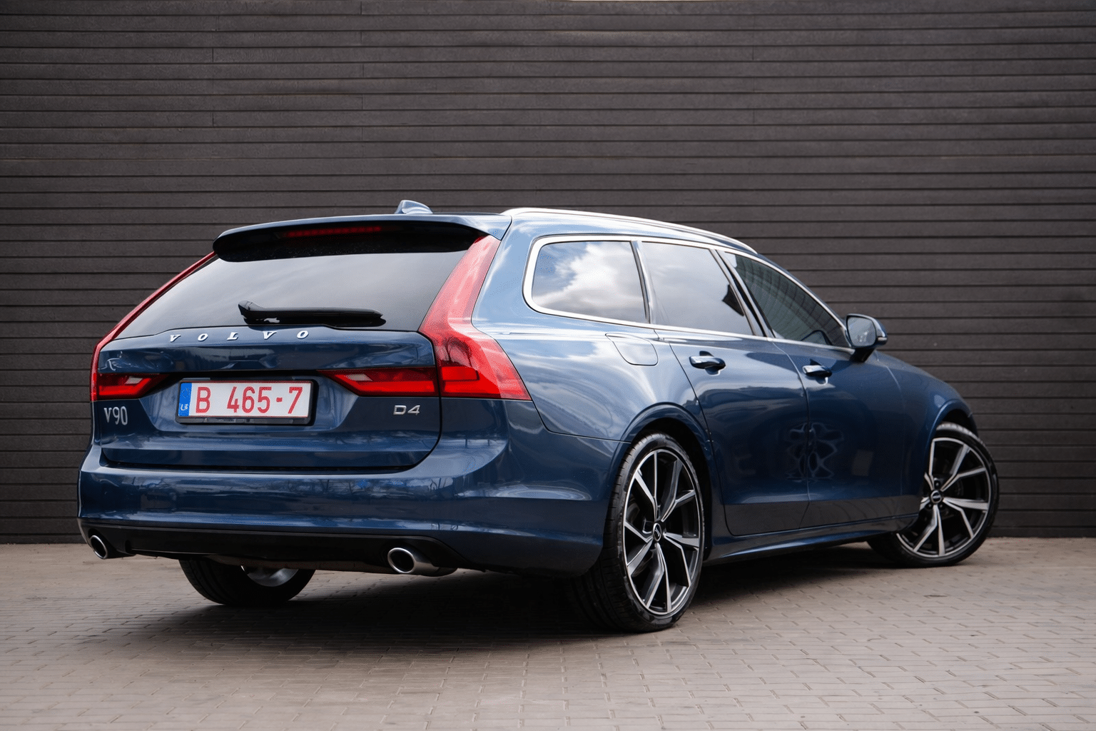 Blue Volvo V90 parked with precision