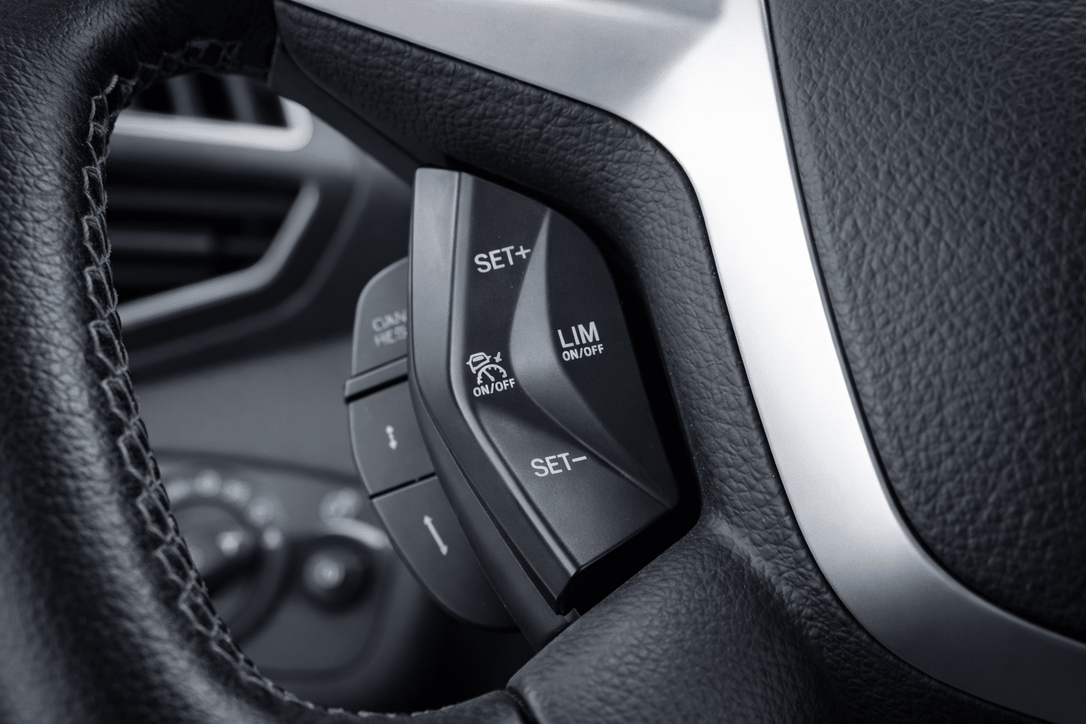 Cruise control buttons on steering wheel