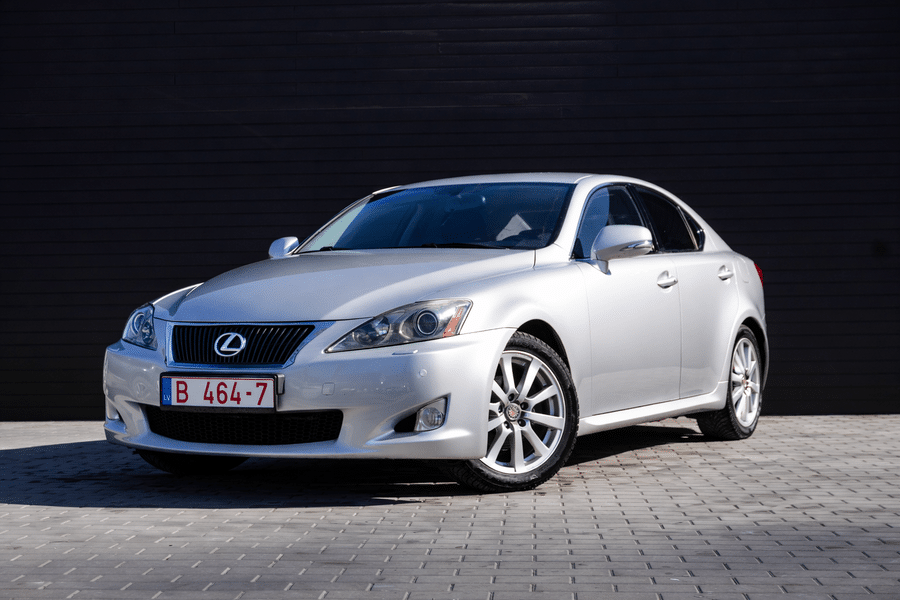 Polished Lexus on grey brick pavement