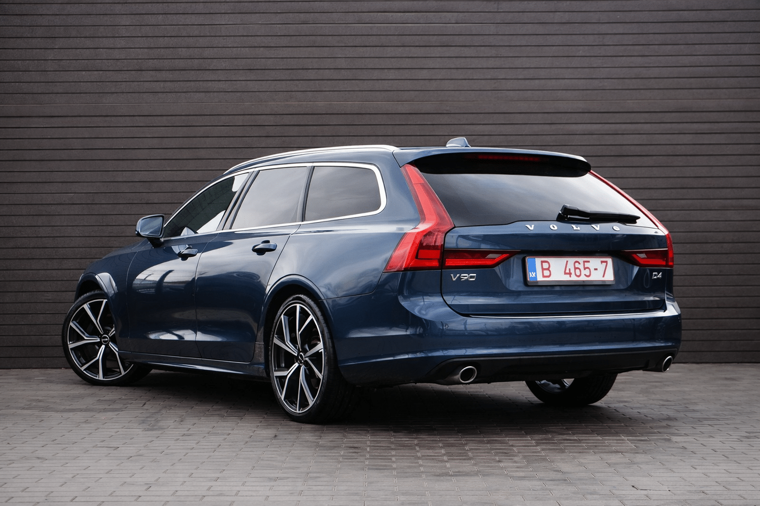 Volvo V90 D4 by wooden wall